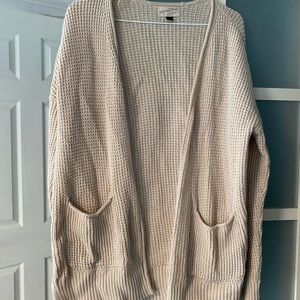 Tan cardigan.